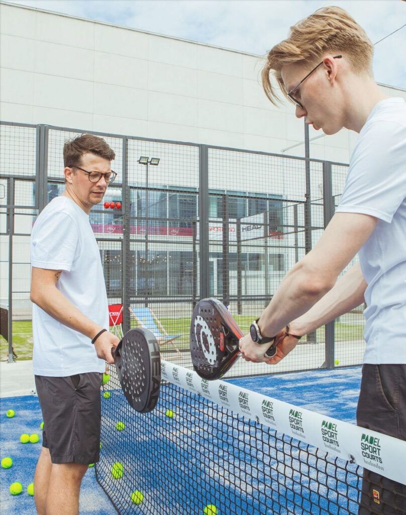 boy playing padel, padel court
